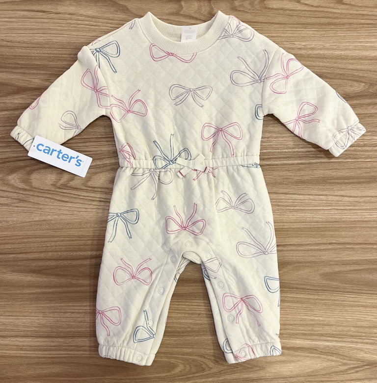 Enterizo beige moños